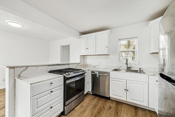 Interior, Kitchen, Recessed Lighting, Stainless Steel Appliances, Wood Texture Flooring