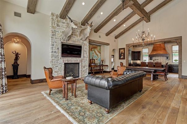 Chandelier, Dining room, Fireplace, Interior, Kitchen, Living room, Pendant Lights, Recessed Lighting, Stone Walls, Wooden Beams, Wood Texture Flooring