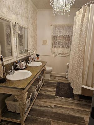 Bathroom, Chandelier, Dual Sink Vanities, Interior, Wood Texture Flooring