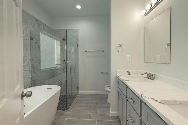 Bathroom, Dual Sink Vanities, Free Standing Baths, Glass Shower, Interior, Marble Walls, Recessed Lighting