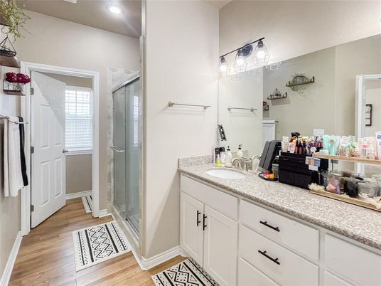Bathroom, Dual Sink Vanities, Glass Shower, Interior, Recessed Lighting, Wood Texture Flooring