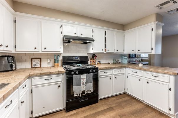 Interior, Kitchen, Tile Countertops, Wood Texture Flooring