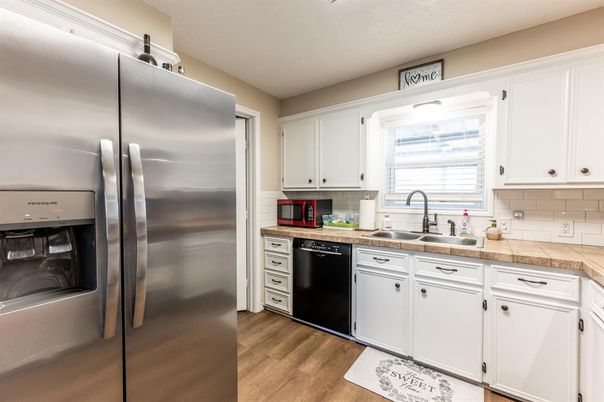 Interior, Kitchen, Stainless Steel Appliances, Tile Countertops, Wood Texture Flooring