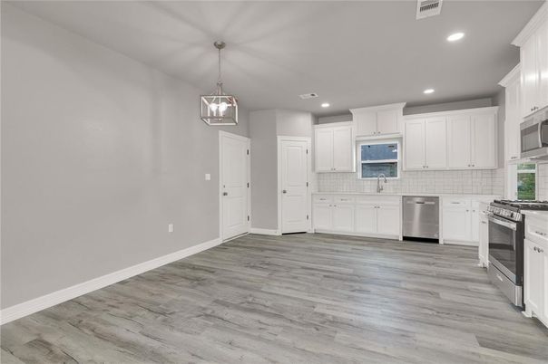 Interior, Kitchen, Pendant Lights, Recessed Lighting, Stainless Steel Appliances, Wood Texture Flooring