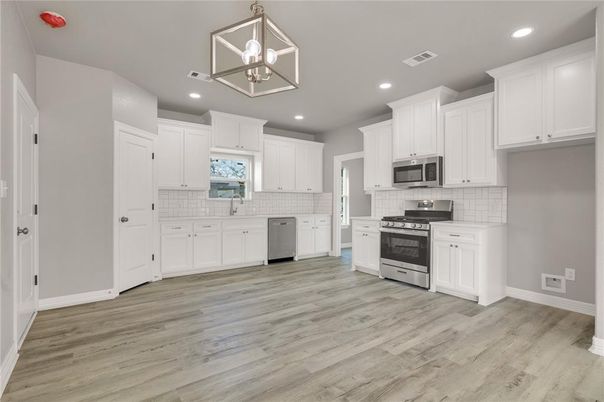 Interior, Kitchen, Pendant Lights, Recessed Lighting, Stainless Steel Appliances, Wood Texture Flooring