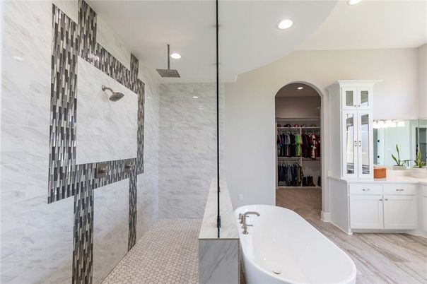 Bathroom, Dual Sink Vanities, Free Standing Baths, Glass Shower, Interior, Marble, Marble Walls, Recessed Lighting, Walk-in Closets, Wood Texture Flooring