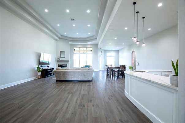 Dining room, Fireplace, Interior, Living room, Pendant Lights, Recessed Lighting, Wood Texture Flooring