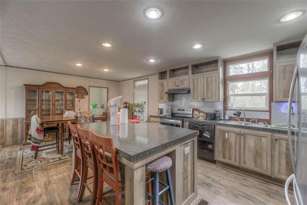 Dining room, Interior, Kitchen, Recessed Lighting, Stainless Steel Appliances, Wood Texture Flooring