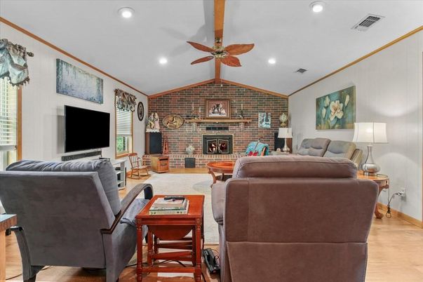 Fireplace, Interior, Living room, Recessed Lighting, Stone Walls, Wood Texture Flooring