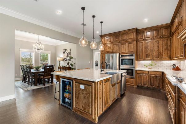 Chandelier, Dining room, Interior, Kitchen, Pendant Lights, Recessed Lighting, Stainless Steel Appliances, Wood Texture Flooring
