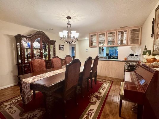 Chandelier, Dining room, Interior, Piano, Wood Texture Flooring