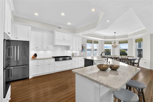 Dining room, Interior, Kitchen, Pendant Lights, Recessed Lighting, Stainless Steel Appliances, Wood Texture Flooring