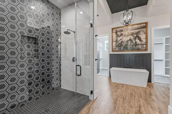 Bathroom, Free Standing Baths, Glass Shower, Interior, Marble Walls, Pendant Lights, Recessed Lighting, Wood Texture Flooring