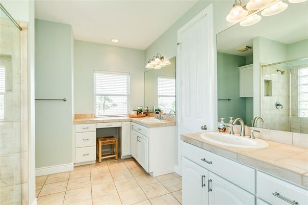 Bathroom, Dual Sink Vanities, Glass Shower, Interior, Recessed Lighting, Tile Countertops