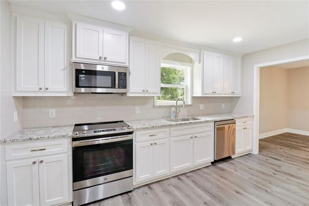 Interior, Kitchen, Recessed Lighting, Stainless Steel Appliances, Wood Texture Flooring