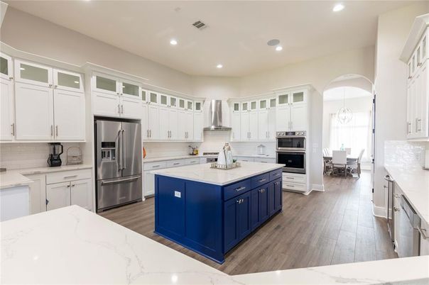 Chandelier, Dining room, Interior, Kitchen, Recessed Lighting, Stainless Steel Appliances, Wood Texture Flooring