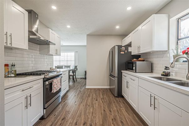 Dining room, Interior, Kitchen, Recessed Lighting, Stainless Steel Appliances, Wood Texture Flooring
