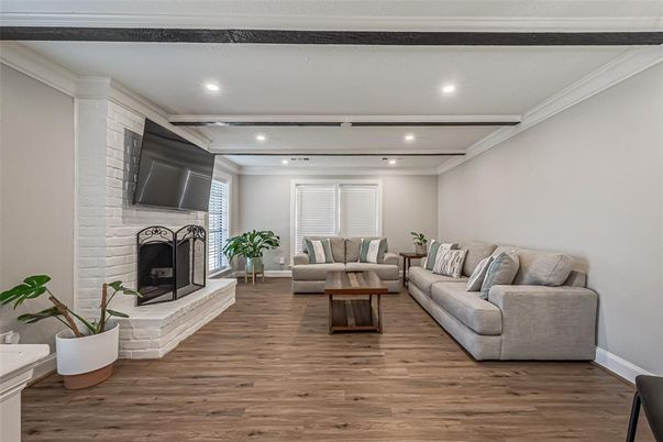Fireplace, Interior, Living room, Recessed Lighting, Stone Walls, Wood Texture Flooring