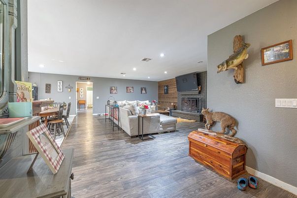 Dining room, Fireplace, Interior, Living room, Recessed Lighting, Wood Texture Flooring