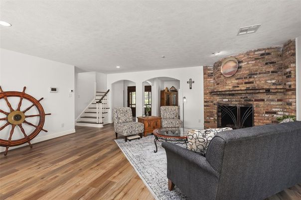 Fireplace, Interior, Living room, Recessed Lighting, Stone Walls, Wood Texture Flooring