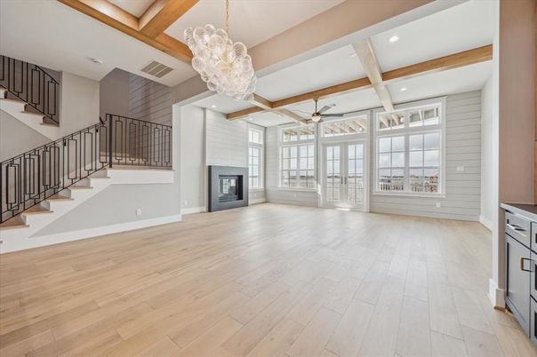 Chandelier, Empty room, Fireplace, Interior, Pendant Lights, Recessed Lighting, Wooden Beams, Wood Texture Flooring