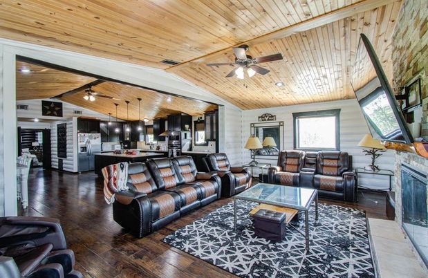 Fireplace, Interior, Kitchen, Living room, Pendant Lights, Recessed Lighting, Stainless Steel Appliances, Stone Walls, Wooden Ceilings, Wood Texture Flooring