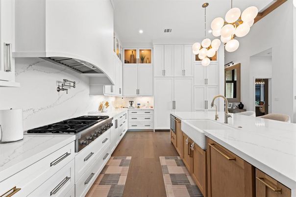 Interior, Kitchen, Marble Walls, Pendant Lights, Recessed Lighting, Stainless Steel Appliances, Wood Texture Flooring