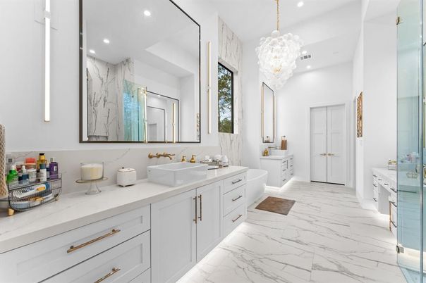 Bathroom, Dual Sink Vanities, Interior, Marble, Marble Walls, Pendant Lights, Recessed Lighting