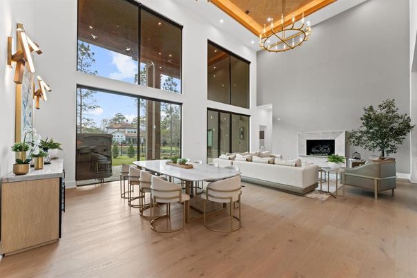 Chandelier, Dining room, Fireplace, Interior, Living room, Pendant Lights, Recessed Lighting, Wood Texture Flooring