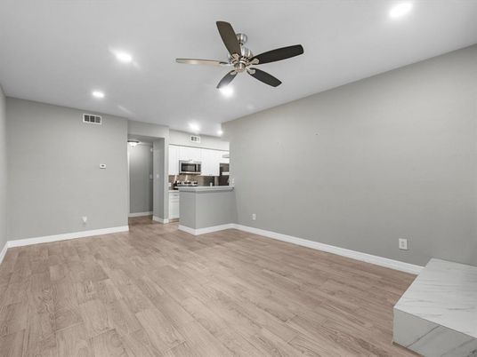 Empty room, Interior, Kitchen, Recessed Lighting, Stainless Steel Appliances, Wood Texture Flooring