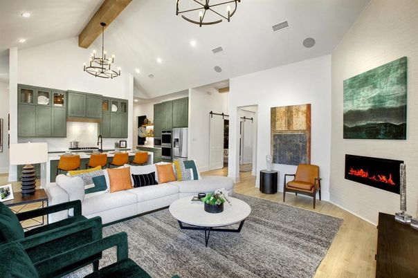 Chandelier, Fireplace, Interior, Kitchen, Living room, Pendant Lights, Recessed Lighting, Stainless Steel Appliances, Wooden Beams, Wood Texture Flooring