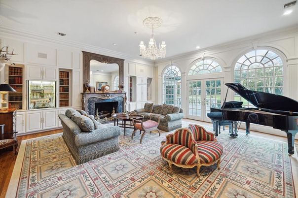 Chandelier, Fireplace, Interior, Living room, Piano, Recessed Lighting, Wood Texture Flooring