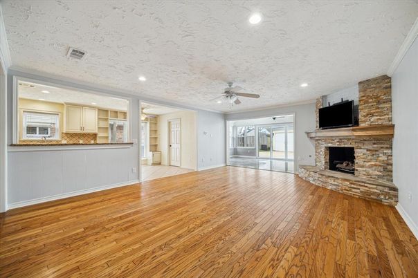Empty room, Fireplace, Interior, Kitchen, Recessed Lighting, Stone Walls, Wood Texture Flooring