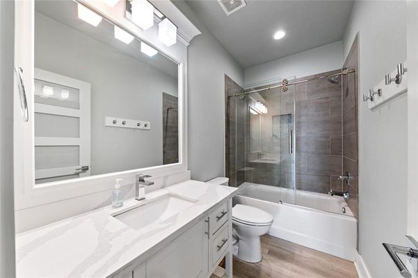 Bathroom, Dual Sink Vanities, Glass Shower, Interior, Recessed Lighting, Wood Texture Flooring