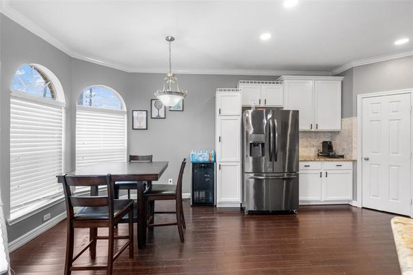 Dining room, Interior, Kitchen, Pendant Lights, Recessed Lighting, Stainless Steel Appliances, Wood Texture Flooring