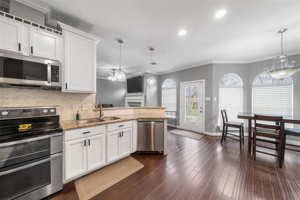 Dining room, Interior, Kitchen, Pendant Lights, Recessed Lighting, Stainless Steel Appliances, Wood Texture Flooring