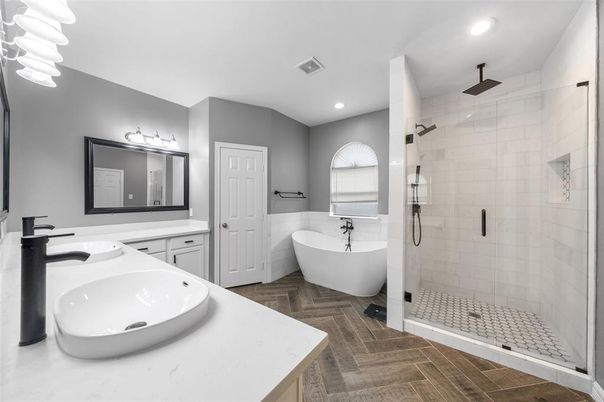 Bathroom, Dual Sink Vanities, Free Standing Baths, Glass Shower, Interior, Recessed Lighting, Wood Texture Flooring