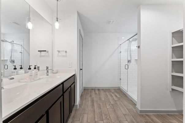 Bathroom, Dual Sink Vanities, Glass Shower, Interior, Pendant Lights, Wood Texture Flooring