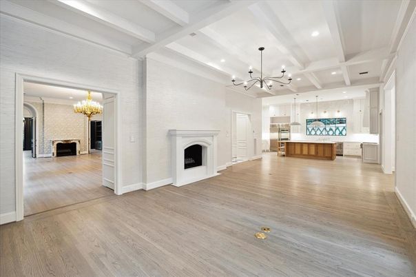 Chandelier, Empty room, Fireplace, Interior, Kitchen, Pendant Lights, Recessed Lighting, Wood Texture Flooring