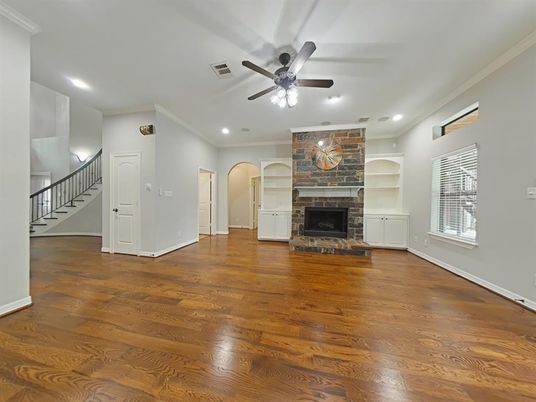Empty room, Fireplace, Interior, Recessed Lighting, Stone Walls, Wood Texture Flooring