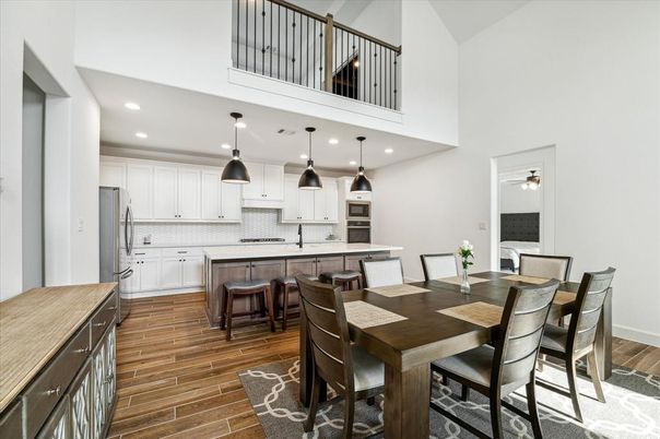 Dining room, Interior, Kitchen, Pendant Lights, Recessed Lighting, Stainless Steel Appliances, Wood Texture Flooring