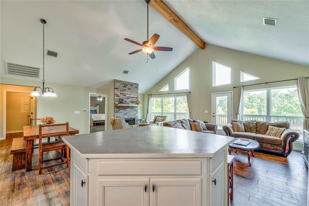 Dining room, Fireplace, Interior, Living room, Pendant Lights, Stone Walls, Wooden Beams, Wood Texture Flooring