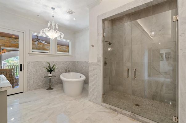 Bathroom, Free Standing Baths, Glass Shower, Interior, Marble, Marble Walls, Pendant Lights, Recessed Lighting