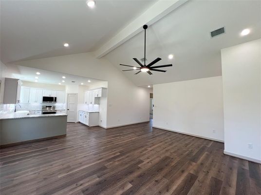 Empty room, Interior, Kitchen, Recessed Lighting, Stainless Steel Appliances, Wood Texture Flooring