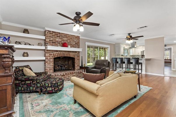 Fireplace, Interior, Living room, Recessed Lighting, Stone Walls, Wood Texture Flooring