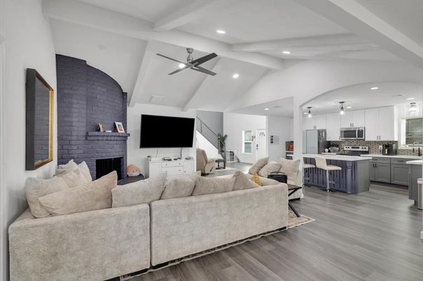 Fireplace, Interior, Kitchen, Living room, Recessed Lighting, Stainless Steel Appliances, Stone Walls, Wood Texture Flooring