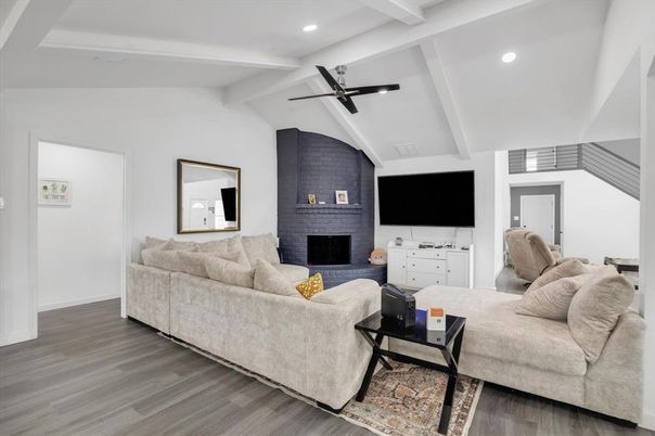 Fireplace, Interior, Living room, Recessed Lighting, Stone Walls, Wood Texture Flooring