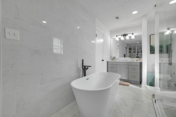 Bathroom, Dual Sink Vanities, Free Standing Baths, Glass Shower, Interior, Marble, Marble Walls, Recessed Lighting