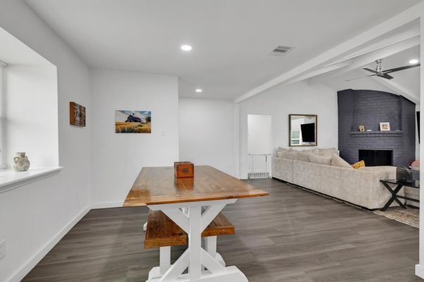 Dining room, Fireplace, Interior, Living room, Recessed Lighting, Stone Walls, Wood Texture Flooring