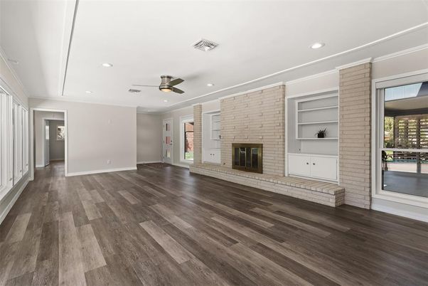 Empty room, Fireplace, Interior, Recessed Lighting, Stone Walls, Wood Texture Flooring